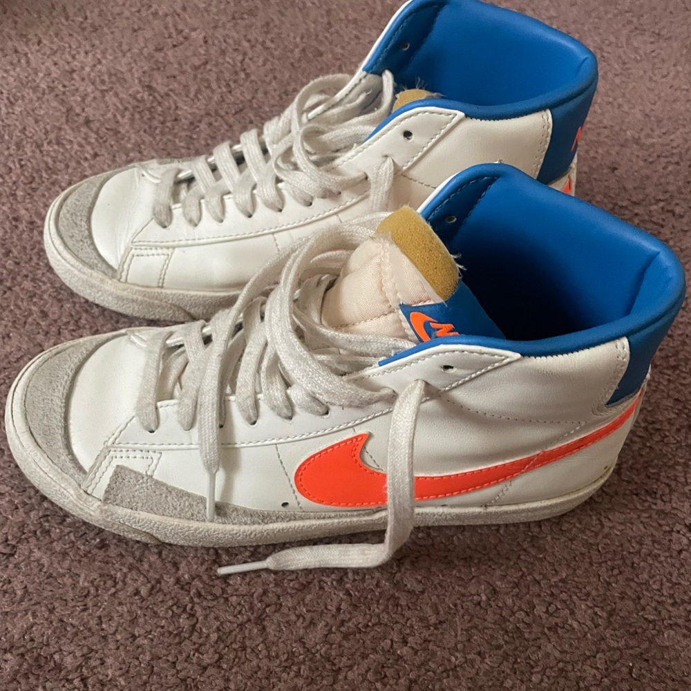 Nike White High-Top Sneakers with Orange Swoosh and Blue Collar